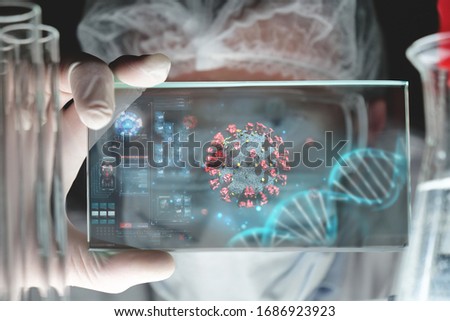 Portrait of futuristic researcher is using futuristic screen with augmented reality coronavirus hologram for viewing results of research in laboratory.Concept of future, science, coronavirus, pandemia Royalty-Free Stock Photo #1686923923