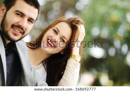 Lovely couple enjoying fall in love at park