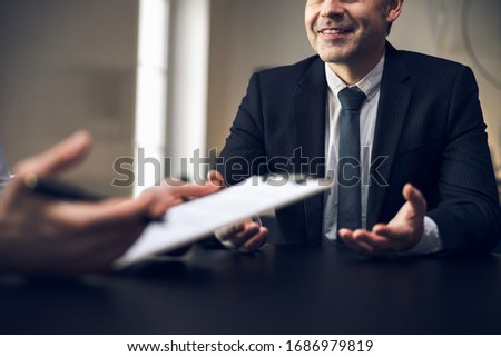 Smiling adult office clerks working in office stock photo. Business concept