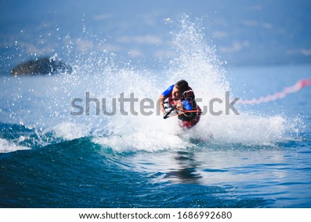 a guy slamming his face on the water