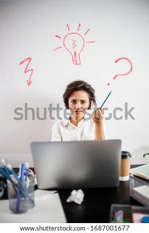 Waist up of indignant lady holding pencil in her hand and looking at camera stock photo