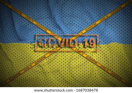 Ukraine flag and Covid-19 stamp with orange quarantine border tape cross. Coronavirus or 2019-nCov virus concept