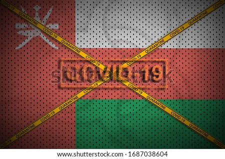 Oman flag and Covid-19 stamp with orange quarantine border tape cross. Coronavirus or 2019-nCov virus concept