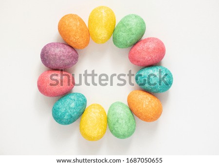 Colourful Easter Eggs in a circle shape on a white background
