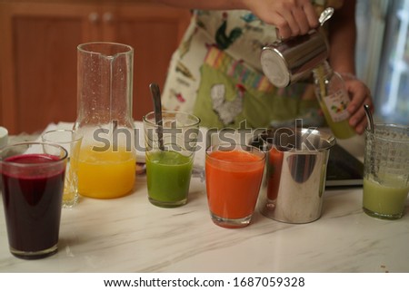 Pile of different fresh squeezed juices