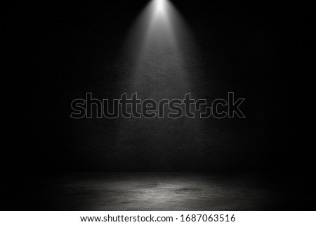 Empty space of Studio dark room black concrete wall and spotlight with concrete floor for showing product. Royalty-Free Stock Photo #1687063516