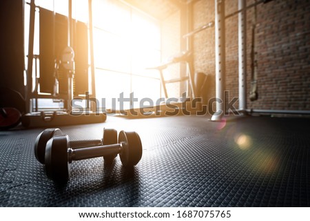 Fitness gym background with sports equipment for workout