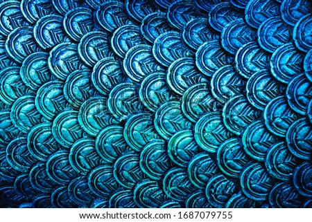 Close Up of the dragon scale. Colourful naga skin pattern texture background. Pattern of serpent king of naga scales or fish scales. Dragon skin or scales. 