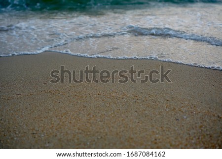  Soft wave on brown sandy beach. Background.    