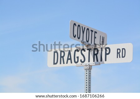 Dragstrip Rd Sign and Coyote Ln Sign in Goodyear, Maricopa County, Arizona USA
