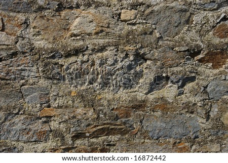 Close up of rough textured old stone wall
