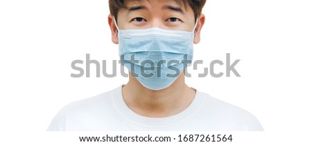 Asian man wearing face mask against the corona virus, covid-19. Close up of  Asian man wearing face mask with white background. Banner of Asian man wearing mask with isolated background. Royalty-Free Stock Photo #1687261564
