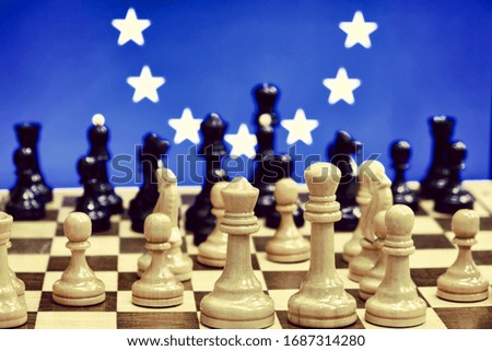 Europe flag on the background of chess with pieces on the Board