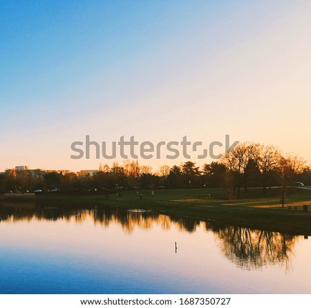 Sunset on the river in park, beautiful autumn nature