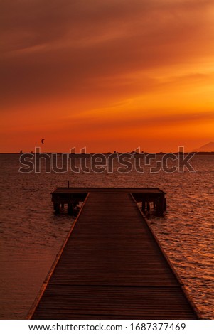 The picture has been taken during summer from a pier in the Stagnone, a low sea water area located next to Marsala, province of Trapani, Sicily region
