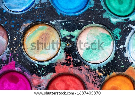 Watercolor Palette Deatail. Old Top View Watercolors with Grunge Splashes.