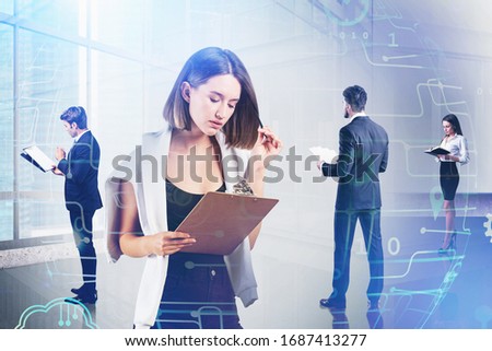 Four business people working with documents in panoramic office with double exposure of cityscape and blurry network interface. Concept of teamwork and internet connection. Toned image