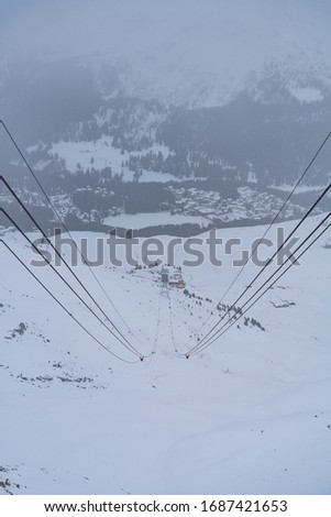 Amazing wintery view of Arosa in Switzerland between swiss alps