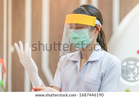Medical staff wearing face shield, medical mask and medical grove for protect coronavirus covid-19 virus in CT scan room, protective Epidemic virus outbreak concept Royalty-Free Stock Photo #1687446190