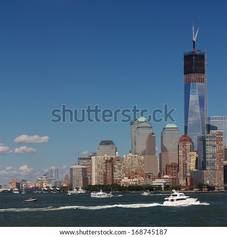 Section of the skyline of Manhattan, New York, NY, USA, at Battery Park with the Freedom Tower under construction.
