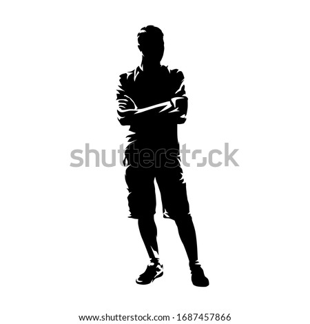 Young man standing with folded arms. Guy wearing shorts and shirt, summer clothing. Isolated vector silhouette, abstract ink drawing