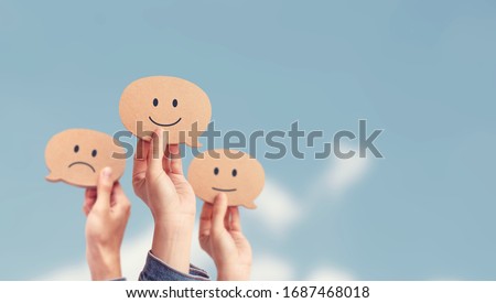 Customer showing rating with happy icon on sky background, Customer satisfaction survey concept, copy space. Royalty-Free Stock Photo #1687468018