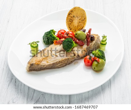 Fried halibut with vegetables and mustard