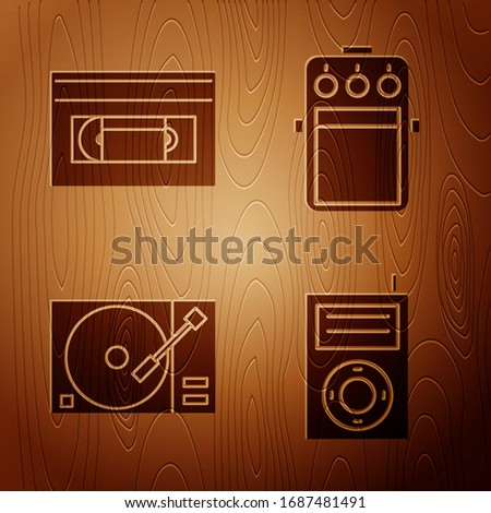 Set Music MP3 player, VHS video cassette tape, Vinyl player with a vinyl disk and Guitar pedal on wooden background. Vector
