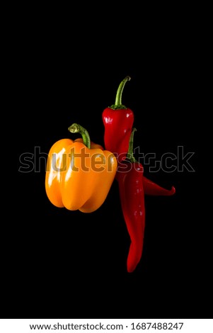 

three bell pepper on a black background