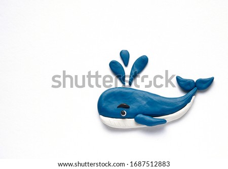 plasticine blue whale  on a white background. Plasticine crafts blue whale