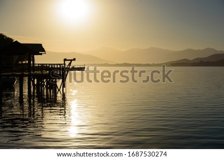 sunrise on a dock in a lake
