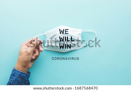 WE WILL WIN on coronavirus,covid-19 outbreak around the world .body health care.medical equipment.demand and supply.hope and solution.big change situation,Protect yourself with mask  Royalty-Free Stock Photo #1687568470