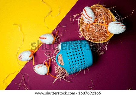 Easter bright background with decorative eggs. Gentle baskets with hay. Holiday picture.