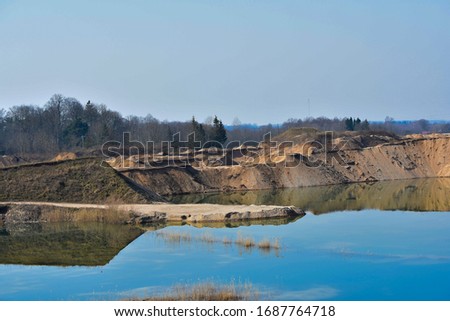 Colourfull picture of gravel pits in the sunny day