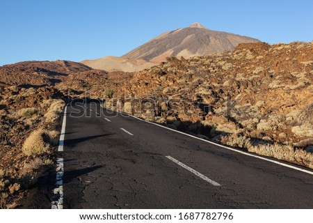 Old highway through volcanic lava fields in the Teide National Park, Tenerife, Canary Islands, Spain.