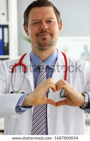 Male medicine doctor hands showing heart shape portrait. Medical help prophylaxis or insurance concept. Cardiology care health protection and prevention healthy heart concept