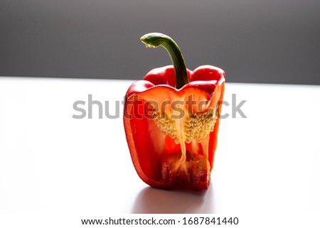 Stock photo of a half red pepper on a white background