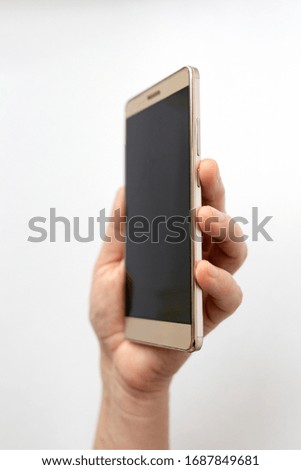 woman hand holding smartphone vertical on the white background