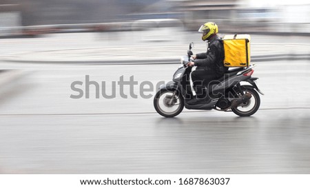 Couriers carry out orders for the delivery of goods Royalty-Free Stock Photo #1687863037