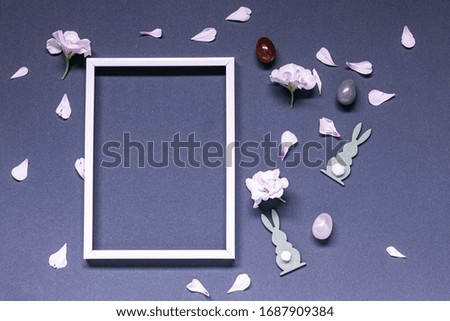 Flowers composition blank frame for text on blue background. Birthday, Easter, Mother's day Women's Day, Valentine's Day
