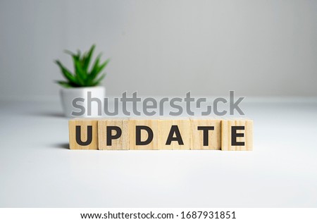 Updating Word Written In Wooden Cube, business concept. Royalty-Free Stock Photo #1687931851