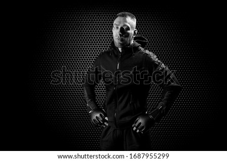 Mixed Martial Arts fighter posing on a metal grid background. Concept of mma, ufc, thai boxing, classic boxing. Mixed media