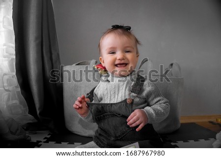 Cutie little baby girl smiles at home
