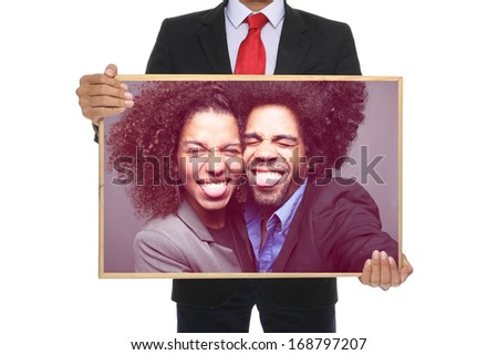 Man holding a board or photo frame