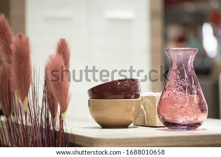 Decorative items in the interior, a Beautiful vase on the table. Cozy items for the home. Royalty-Free Stock Photo #1688010658