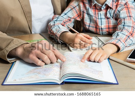 Homeschooling. Father helps daughter with her homework.
Learning concept. Communication concept. Royalty-Free Stock Photo #1688065165
