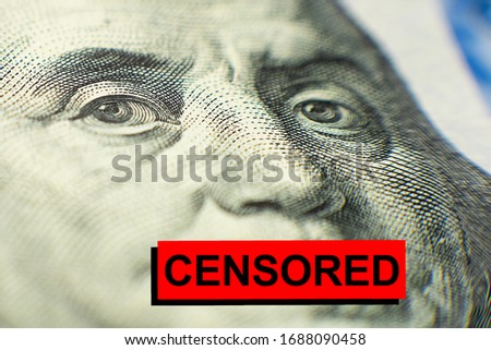 portrait of Benjamin Franklin from a hundred-dollar bill with a closed mouth and the caption title CENSORED. paid censorship concept. corrupt practices. silence for money. Royalty-Free Stock Photo #1688090458
