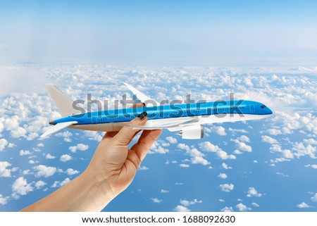 Concept of support and help to airlines. The plane in the air, In caring hands. Manual control of the aircraft. Safe flight