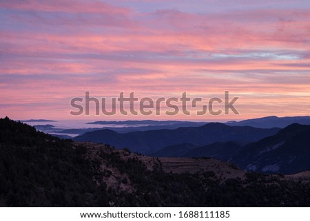 Photography of mountain landscape with pink clouds and a sea of clouds on the horizon