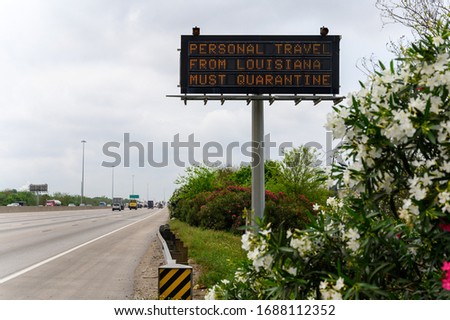 A sign along I-610 warns that Texas will enforce quarantine orders to Louisiana drivers entering state